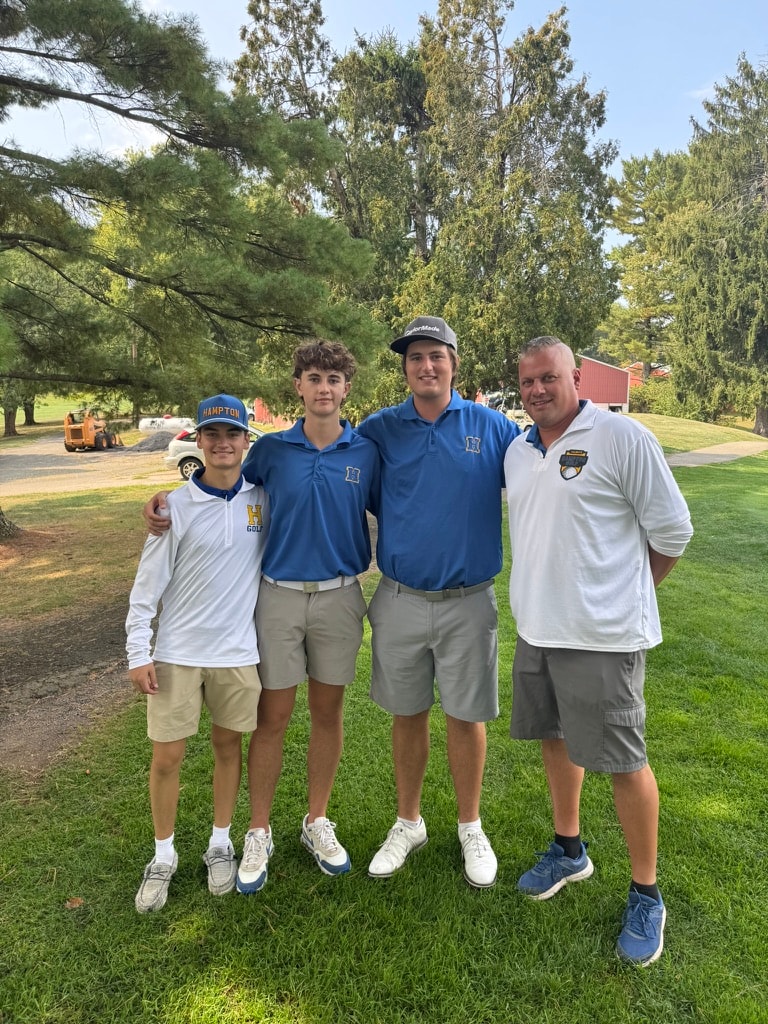 Hampton Golf team members and coach at a match