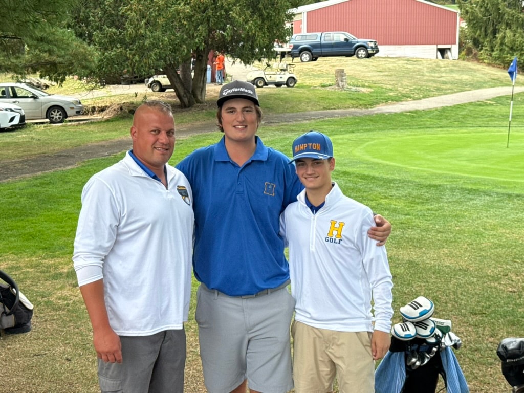 Hampton Golf players and coach at a golf event